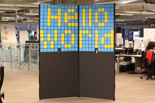 Pair of SHAY boards covered in Post-It notes reading "Hello World" 